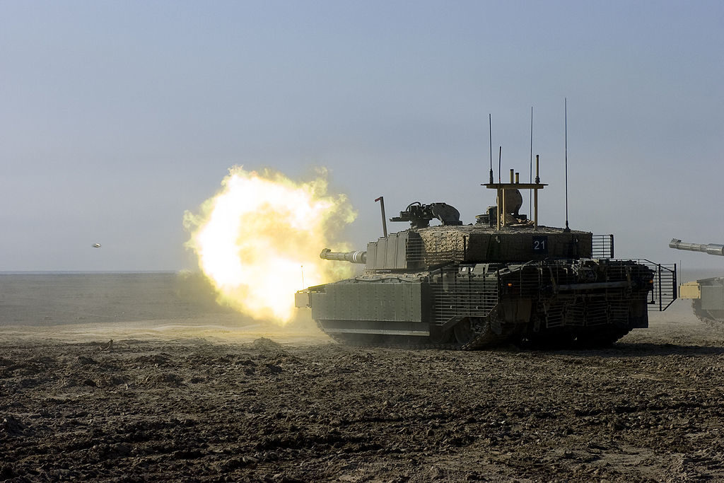 A British army Challenger II main battle tank from the Royal Scots Dragoon Guards fires at a target during a training exercise in Basra, Iraq. (Sgt. Gustavo Olgiati, U.S. Army)