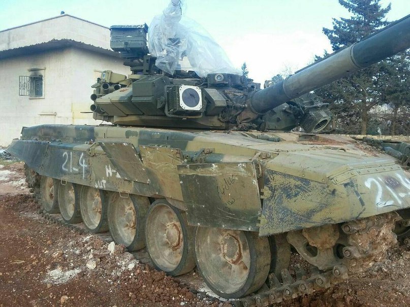 Photograph of Russian T-90 tank following a hit by a U.S.-made TOW missile in Syria. [War Is Boring.com]